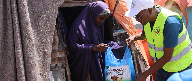 ARF team distributing Qurbani meat to a family
